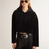 Schwarzes Chenille-Sweatshirt für Damen mit Stickerei auf dem Rücken Schwarzes Chenille-Sweatshirt für Damen mit Stickerei auf dem Rücken