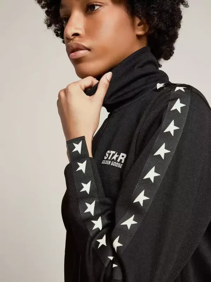 Schwarzes Damen-Sweatshirt mit Reißverschluss und weißen Sternen Schwarzes Damen-Sweatshirt mit Reißverschluss und weißen Sternen