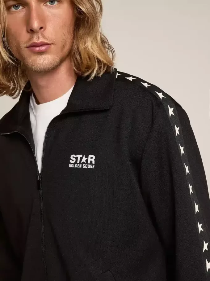 Schwarzes Herren-Sweatshirt mit Reißverschluss und weißen Sternen Schwarzes Herren-Sweatshirt mit Reißverschluss und weißen Sternen