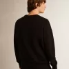 Schwarzes Sweatshirt aus der Archibald Star Collection mit ton-in-ton Stern auf der Vorderseite