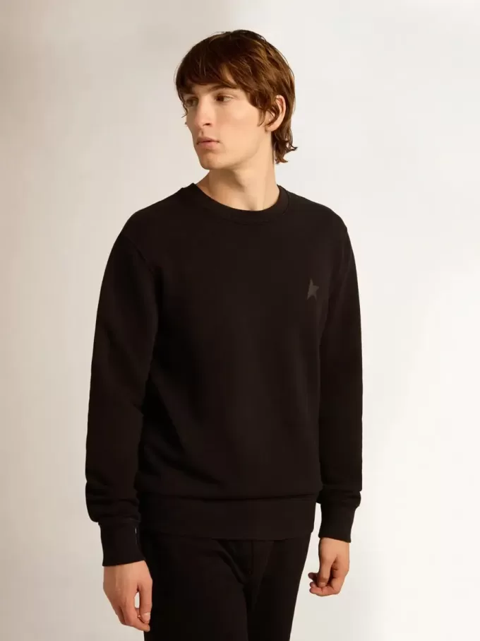 Schwarzes Sweatshirt aus der Archibald Star Collection mit ton-in-ton Stern auf der Vorderseite