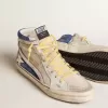 Slide aus perlfarbenem Canvas und blauem Wildleder mit weißem Lederstern und Blitz Slide aus perlfarbenem Canvas und blauem Wildleder mit weißem Lederstern und Blitz