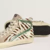 Slide-Sneaker für Damen aus Ponyfell mit Zebradruck und grünem Laminatleder-Detail