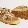 Super-Star aus beigem Wildleder und Lammfell mit Stern aus Metallic-Leder