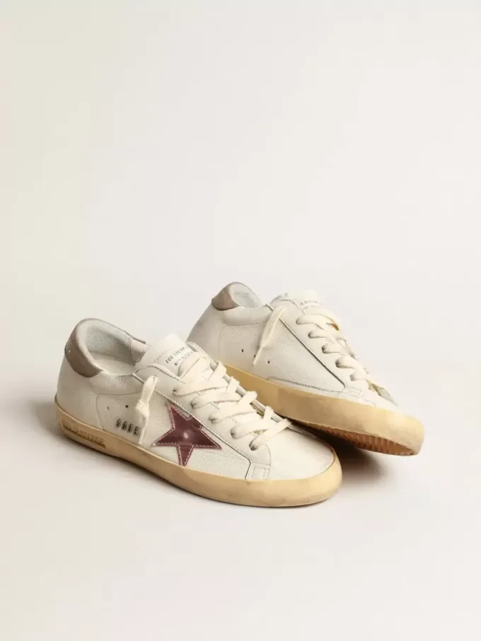 Super-Star für Damen aus weißem Nappaleder mit rosa Metallic-Lederstern
