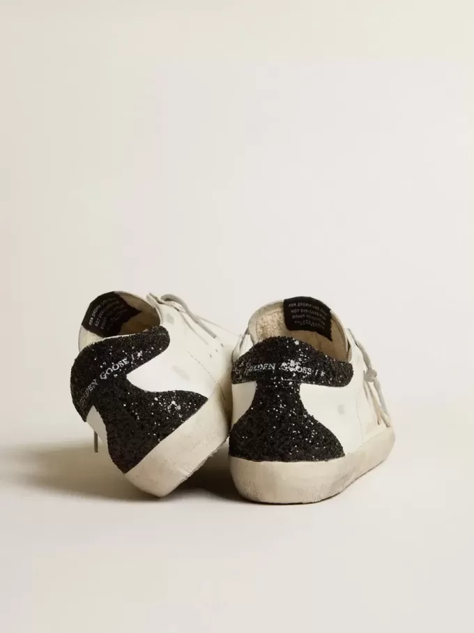 Super-Star für Damen mit goldenem Stern und schwarzem Glitzer-Fersenriemen