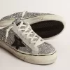 Super-Star Sabot für Damen in silbernem Glitzer mit schwarzem Lederstern Super-Star Sabot für Damen in silbernem Glitzer mit schwarzem Lederstern
