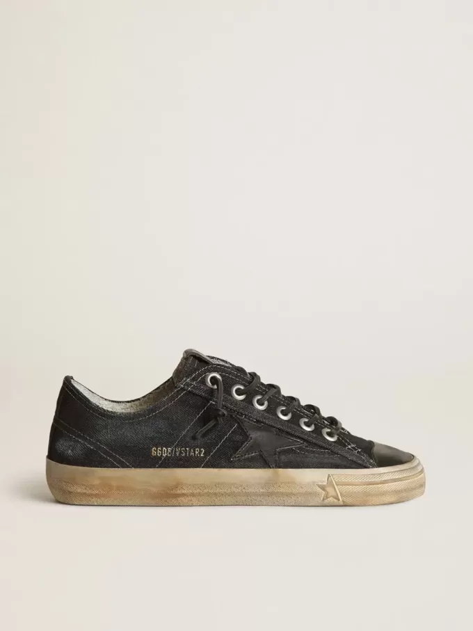 V-Star aus mitternachtsblauem Denim mit schwarzem Lederstern und Zehenkappe