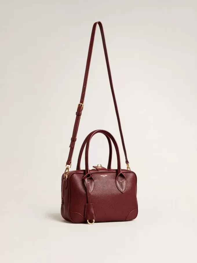 Vita Bag aus burgunderrotem Leder mit goldenen Details