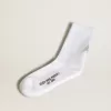 Weiße Socken mit Kristallstern auf der Rückseite Weiße Socken mit Kristallstern auf der Rückseite