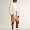 Weißer Baumwollcardigan für Herren mit Zopfmuster und blauen Rippbündchen Weißer Baumwollcardigan für Herren mit Zopfmuster und blauen Rippbündchen