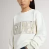 Weißes Sweatshirt für Mädchen mit mehrfarbiger „Golden”-Schrift auf der Vorderseite Weißes Sweatshirt für Mädchen mit mehrfarbiger „Golden”-Schrift auf der Vorderseite