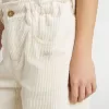 Weite, cremefarbene Mädchenhose mit Rippstrick und Stickerei